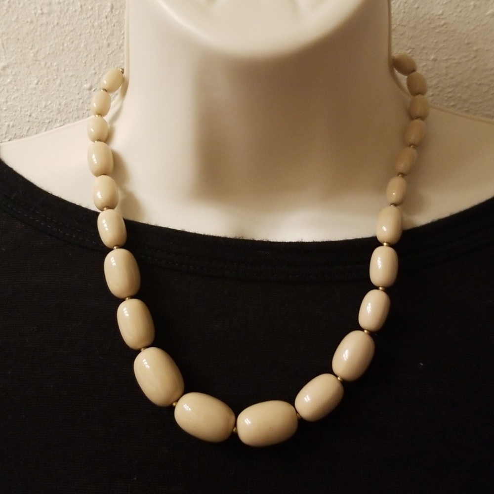 Tan beaded necklace.